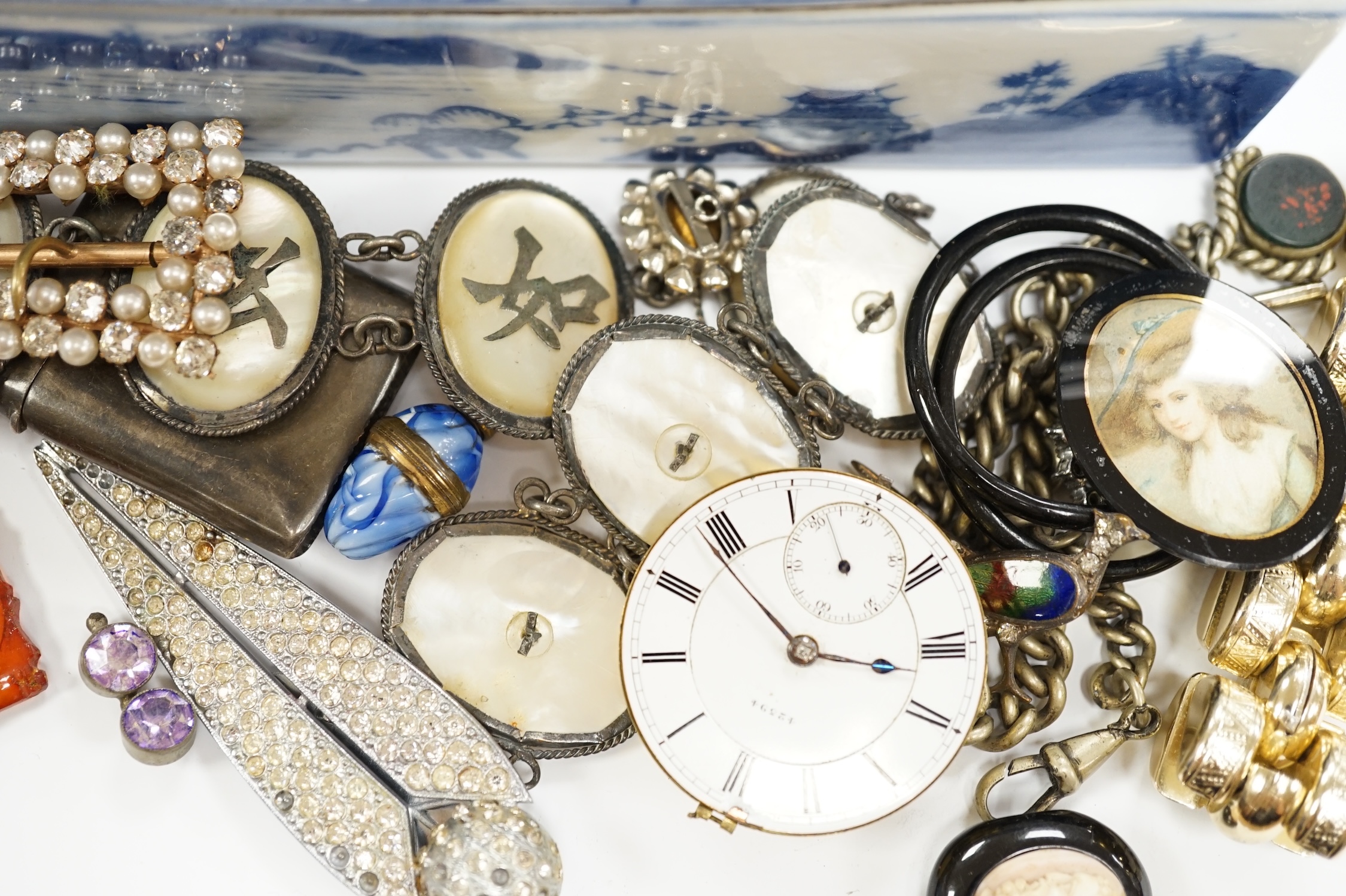 A quantity of assorted costume jewellery and watch movements.